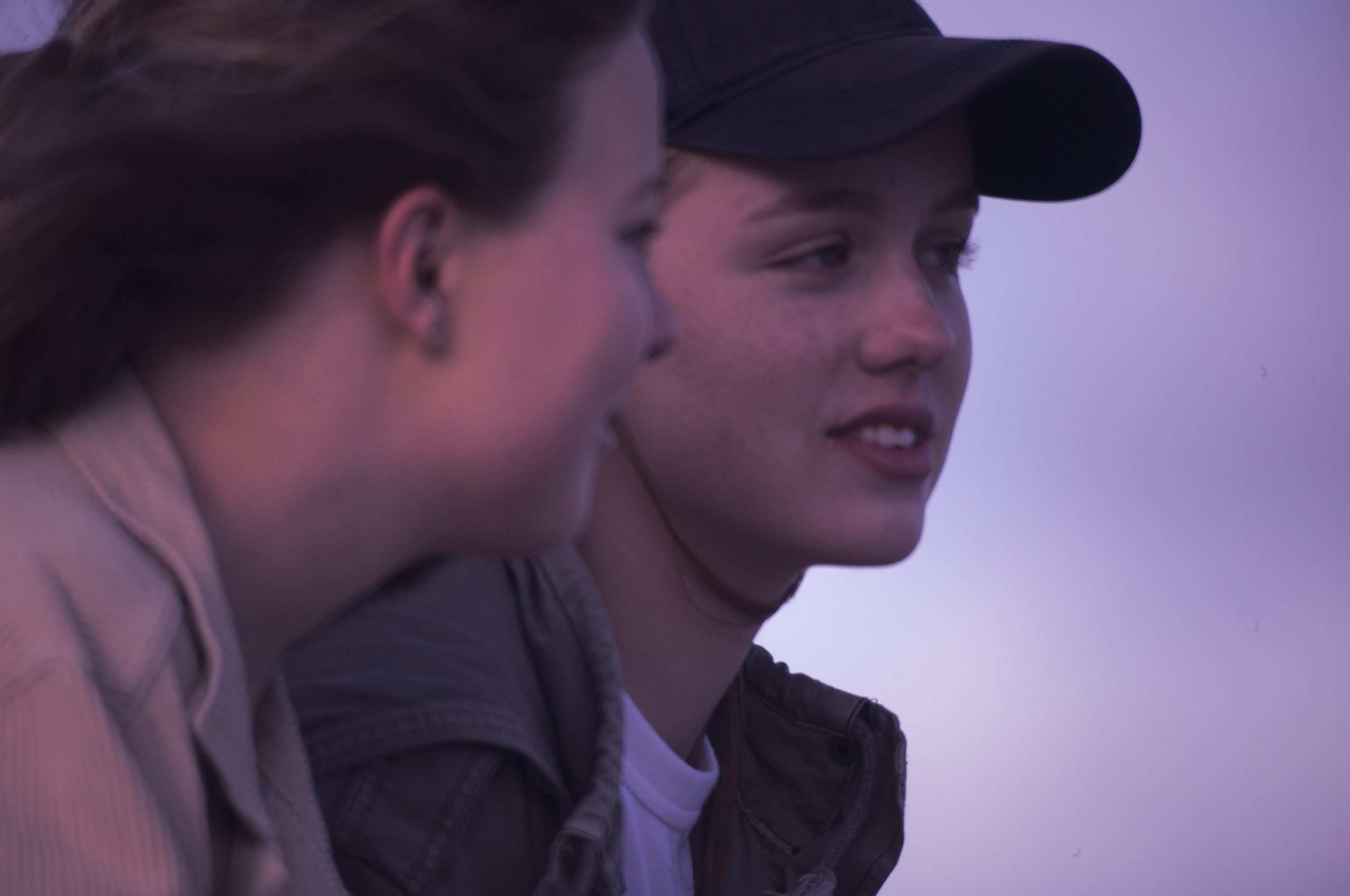 Two teenagers engaged in conversatoin